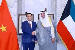 Le Premier ministre Pham Minh Chinh et son homologue koweïtien, Cheikh Ahmad Al-Abdullah Al-Sabah. Photo: VNA