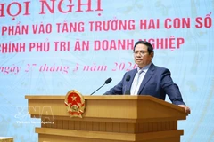 Le Premier ministre Pham Minh Chinh s’exprime lors de la conférence. Photo : VNA