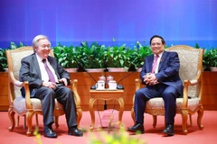 Le secrétaire général des Nations Unies, António Guterres (gauche) et e Premier ministre Pham Minh Chinh. Photo: VNA