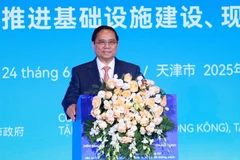 Le Premier ministre Pham Minh Chinh s'exprime lors du Forum des entreprises Chine-Vietnam. Photo: VNA
