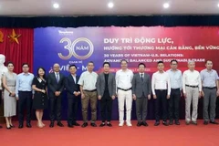 Séminaire "30 ans de relations entre Vietnam-États-Unis : Faire progresser un commerce équilibré et durable", organisé le 11 juillet à Hanoï. Photo: VNA