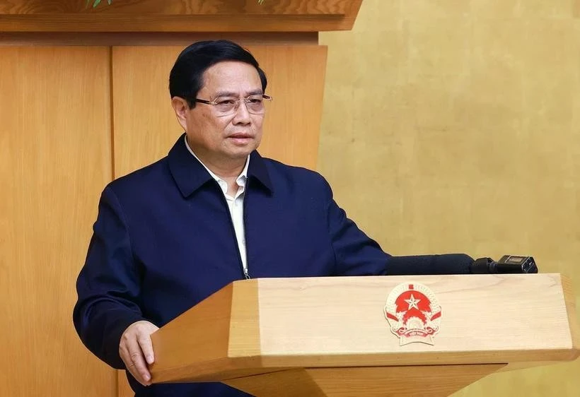 Le Premier ministre Pham Minh Chinh préside la réunion périodique de janvier du gouvernement. Photo: VNA