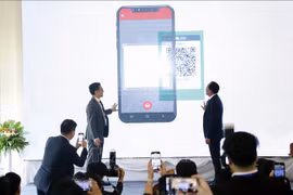 Lancement d’un système de paiement transfrontalier par code QR entre la Thaïlande et le Laos