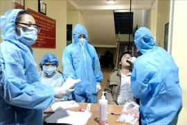 COVID-19 : distanciation sociale au district de Van Don de la province de Quang Ninh