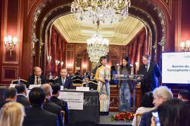 Le dirigeant To Lam assiste à la remise du Prix de la francophonie économique au groupe vietnamien FPT et à la société Made For A Woman de Madagascar. Photo: VNA