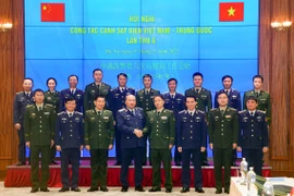 Vietnam-Chine : les Garde-côtes promeuvent leur coopération dans l'application de la loi maritime