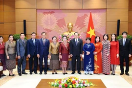 AN : le Vietnam et le Laos partagent leur expérience dans les affaires sociales