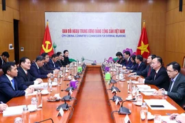 Le Vietnam et le Laos partagent des expériences dans la mobilisation des masses