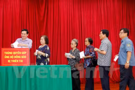 Typhon Doksuri : la communauté vietnamienne au Laos aux côtés des sinistrés du Centre