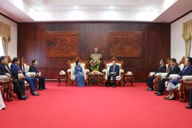 Le Vietnam et le Laos partagent leur expérience sur la mobilisation des masses