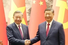 Le secrétaire général du PCV et président To Lam et son homologue chinois Xi Jinping. Photo: VNA