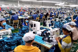 Dans une usine de confection textile à Binh Phuoc. Photo: VNA