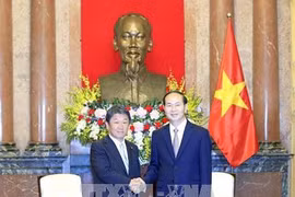 Le président Tran Dai Quang reçoit le ministre japonais de la Revitalisation économique