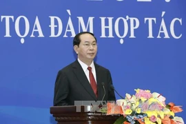Tran Dai Quang au colloque de coopération économique et commerciale Vietnam-Chine
