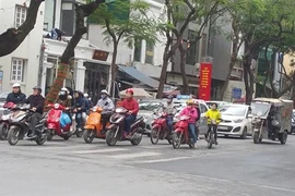 La plupart des Vietnamiens respectent le port du casque de moto