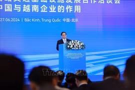 Le Premier ministre Pham Minh Chinh s'exprime lors de la conférence. Photo: VNA