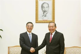 Le vice-PM Truong Hoa Binh reçoit le président de la Cour populaire suprême chinoise