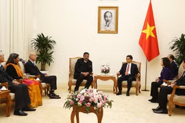 Le vice-PM Vu Duc Dam reçoit la délégation du village SOS international des enfants