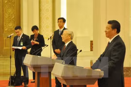 Le secrétaire général du Parti communiste du Vietnam (PCV) Nguyen Phu Trong et son homologue chinois Xi Jinping à la 15e édition des Rencontres d'amitié des jeunes Vietnam-Chine. 