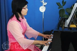 Compositrice, pianiste et professeur de musique d’origine vietnamienne, Hoang Thi Kieu Anh. (Source : VNA)