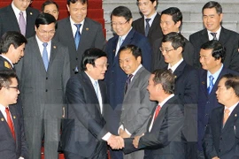Le président vietnamien Truong Tan Sang rencontre les 63 entreprises lauréates du programme "Label national 2014". (Source : VNA)