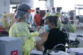 COVID-19: Le Laos exhorte les gens à limiter les rassemblements de masse