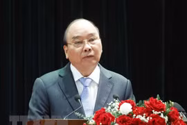 Le président Nguyên Xuân Phuc souligne le rôle du travail sur la population