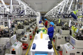 La chaîne de production de chaussettes de la sarl Jasan Vietnam, investie par la Chine, dans le Parc industriel VSIP Hai Phong. Photo d'archives : VNA