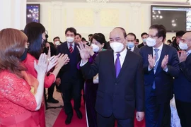 Le président Nguyên Xuân Phuc rencontre la communauté vietnamienne en Russie