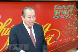 Le vice-PM Truong Hoa Binh rencontre la communauté vietnamienne en Suisse à l'occasion du Têt