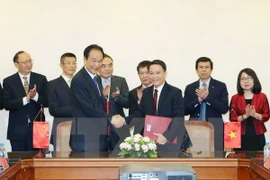Signature d’un accord de coopération entre VNA et Xinhua