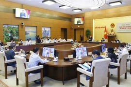 Débat sur la reprise socio-économique en phase post-pandémique au Vietnam