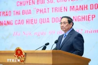 Le Premier ministre Pham Minh Chinh, président du Conseil central d'Émulation et de Récompense préside la cérémonie de lancement de deux mouvements majeurs. Photo : VNA