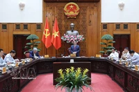 Le Premier ministre Pham Minh Chinh préside la réunion de la permanence du gouvernement sur la préparation de la mise en œuvre du projet de réserve nationale de pétrole brut à Nghi Son. Photo : VNA