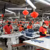 Ligne de production de vêtements destinés à l'exportation. Photo : VNA