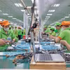 Chaîne d’assemblage des produits après transformation dans l’usine de Bandai Vietnam. Photo : VNA