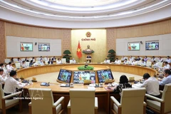 Panorama de la réunion ordinaire du gouvernement pour mars. Photo: VNA