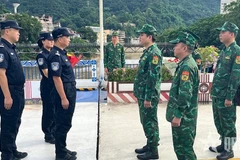 Le commandement de patrouille conjointe à la ligne de démarcation du poste frontalier international de Lào Cai. Photo : qdnd.vn 