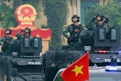 Des véhicules spéciaux de la police participent à la répétition du défilé. Photo: VNA