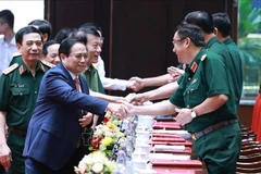 Le Premier ministre Pham Minh Chinh à la conférence politico-militaire de l'Armée. Photo: VNA