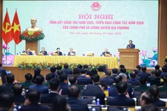 Le Premier ministre Pham Minh Chinh s'exprime lors de la conférence. Photo: VNA