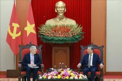 Le secrétaire général du Comité central du Parti communiste du Vietnam To Lam (droite) et le PDG du Conseil des affaires États-Unis-ASEAN, Ted Osius. Photo : VNA 