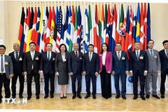 La délégation vietnamienne dirigée par le ministre des Finances, Nguyen Van Thang, lors de l'événement. Photo : VNA