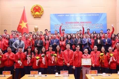 Délégués lors de la cérémonie de Hanoï. Photo : VNA