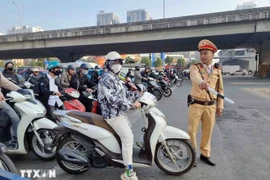 Le décret n°168/2024/ND-CP du gouvernement a prouvé son efficacité en améliorant la conscience des conducteurs. Photo: VNA