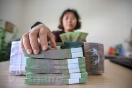 Lors des deux premiers mois de l'année 2026, les recettes budgétaires totales de l'Etat ont atteint 601.300 milliards de dongs. Photo: Vietnam+