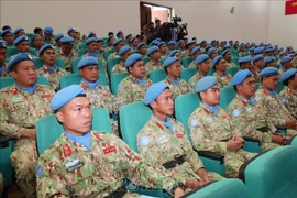Membres de l’Hôpital de campagne de niveau 2 n°6 et du Détachement du Génie n°3 à la conférence. Photo: VNA