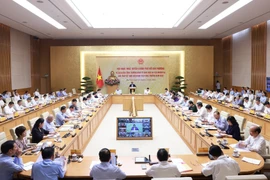 Visioconférence entre le gouvernement et les autorités locales, consacrée au scénario de croissance économique pour 2025. Photo: VNA