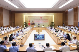Visioconférence entre le gouvernement et les autorités locales, consacrée au scénario de croissance économique pour 2025. Photo: VNA