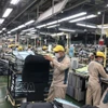 Activités de production de Toyota Boshoku Hanoi. Photo: VNA
